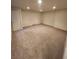 Unfinished basement with carpet, offering potential for customization and expansion at 10712 Dayton Way, Commerce City, CO 80640