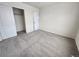 Carpeted bedroom with closet and neutral color scheme, perfect for personalization at 10712 Dayton Way, Commerce City, CO 80640