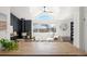 Modern kitchen with a view of the living room and wood burning stove at 3407 W Arkansas Ave, Denver, CO 80219