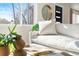 Bright living room showcasing a white couch and a large window with natural light at 3407 W Arkansas Ave, Denver, CO 80219