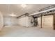 Unfinished basement with concrete floor and white plastic-covered walls, ready to be personalized at 798 Sawdust Dr, Brighton, CO 80601