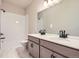 Modern bathroom with double sink vanity, subway tiled shower/tub, and sleek fixtures at 798 Sawdust Dr, Brighton, CO 80601