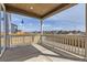 Covered patio offering outdoor living space and neighborhood views at 798 Sawdust Dr, Brighton, CO 80601