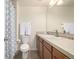 Well-lit bathroom with white fixtures, towel rack and neutral color scheme at 3578 Tranquility Trl, Castle Rock, CO 80109