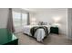 A serene bedroom featuring neutral decor, ample natural light, and plush bedding at 3578 Tranquility Trl, Castle Rock, CO 80109