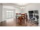 Cozy dining area with hardwood floors, adjacent to the loft and an office setup at 3578 Tranquility Trl, Castle Rock, CO 80109