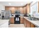 Bright kitchen with stainless steel appliances, light countertops and tile backsplash at 3578 Tranquility Trl, Castle Rock, CO 80109