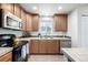 A well-maintained kitchen features stainless steel appliances and plenty of counter space at 3578 Tranquility Trl, Castle Rock, CO 80109