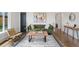 Cozy living room with hardwood floors, modern decor, and a comfortable green sofa at 3379 Krameria St, Denver, CO 80207