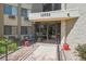 Building entrance featuring a ramp with handrails and glass doors under a canopy with the building's address at 13952 E Marina Dr # 509, Aurora, CO 80014