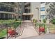 Building entrance with a well maintained pathway and accessible ramp at 13952 E Marina Dr # 509, Aurora, CO 80014