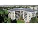 High-rise condominium buildings offering a beautiful urban lifestyle with mature trees and landscaping at 13952 E Marina Dr # 509, Aurora, CO 80014