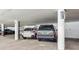 A parking garage featuring multiple parking spots and concrete columns at 13952 E Marina Dr # 509, Aurora, CO 80014
