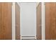 Hallway featuring multiple storage closets with paneled doors on either side at 13952 E Marina Dr # 509, Aurora, CO 80014