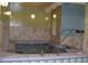 Relaxing indoor hot tub area with tile surround and easy access at 13952 E Marina Dr # 509, Aurora, CO 80014