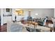 Open concept living room with hardwood floors and cozy seating near the kitchen at 13952 E Marina Dr # 509, Aurora, CO 80014