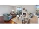 Comfortable living room featuring a fireplace, balcony access, and a cozy seating arrangement at 13952 E Marina Dr # 509, Aurora, CO 80014