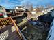 Backyard and water feature seen from wooden deck of house at 9135 W Maplewood Ave, Littleton, CO 80123