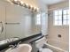 Bathroom featuring a tub, shower, and large mirror with vanity lighting at 9135 W Maplewood Ave, Littleton, CO 80123