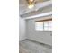 Bedroom with neutral paint, wood-look floor and a window providing natural light at 9135 W Maplewood Ave, Littleton, CO 80123