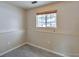 Bedroom with neutral paint, tile floor and a window providing natural light at 9135 W Maplewood Ave, Littleton, CO 80123