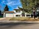 Charming two-story home with landscaped yard and attached two car garage at 9135 W Maplewood Ave, Littleton, CO 80123