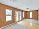 Spacious living room featuring lots of natural light, an exposed ceiling fan, and sliding glass doors at 9135 W Maplewood Ave, Littleton, CO 80123