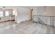 Open-concept living room with light-wood flooring and an adjacent kitchen at 9135 W Maplewood Ave, Littleton, CO 80123