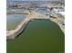 Aerial view of a park with a pond and walking paths at 3553 W 63Rd Ave, Denver, CO 80221