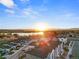 Aerial view of townhouses with lake and mountain views, showcasing natural beauty at 3553 W 63Rd Ave, Denver, CO 80221