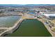 Aerial view of a park with a pond and walking paths at 3553 W 63Rd Ave, Denver, CO 80221