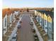 Aerial view of townhouses with mountain views and a tranquil neighborhood setting at 3553 W 63Rd Ave, Denver, CO 80221