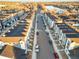 Drone view of townhouses community near a lake, offering a bird's eye perspective at 3553 W 63Rd Ave, Denver, CO 80221