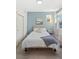 Light and airy bedroom with a queen-size bed and light blue walls at 3553 W 63Rd Ave, Denver, CO 80221