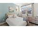 Light and airy bedroom with a queen-size bed and light blue walls at 3553 W 63Rd Ave, Denver, CO 80221