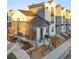 Modern two-story townhome with a gray and white exterior at 3553 W 63Rd Ave, Denver, CO 80221