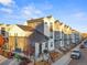 Modern two-story townhouses with gray and white exterior, showcasing a clean design at 3553 W 63Rd Ave, Denver, CO 80221