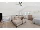 Open loft area with sectional sofa and ceiling fan at 3553 W 63Rd Ave, Denver, CO 80221