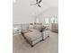 Open loft area with sectional sofa and ceiling fan at 3553 W 63Rd Ave, Denver, CO 80221