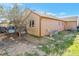 Expansive backyard with a deck, showcasing ample space and a home's exterior at 5106 Eagle Ct, Denver, CO 80239
