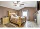Main bedroom features hardwood style floors, ceiling fan, and natural light at 5106 Eagle Ct, Denver, CO 80239