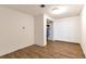 A room features wood floors and a closet with hanging storage, offering potential for customization at 5106 Eagle Ct, Denver, CO 80239
