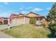Well-maintained single-story home with a manicured lawn and mature trees at 5106 Eagle Ct, Denver, CO 80239