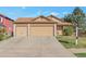 Charming single-story home showcasing a large driveway and attached two-car garage at 5106 Eagle Ct, Denver, CO 80239
