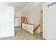 Hallway view with hardwood style floors and staircase access at 5106 Eagle Ct, Denver, CO 80239