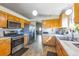 Well-equipped kitchen with stainless steel appliances, modern countertops, and wooden flooring at 5106 Eagle Ct, Denver, CO 80239