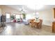 Bright living room features a large bay window, ceiling fan and hardwood style floors at 5106 Eagle Ct, Denver, CO 80239