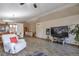Open living area with hardwood style floors, speaker system, and view to the dining room at 5106 Eagle Ct, Denver, CO 80239