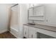 Well-lit bathroom featuring a shower-tub combo and vanity at 7755 E Quincy Ave # 203A2, Denver, CO 80237