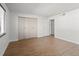 Bedroom with wood floors and large closet at 7755 E Quincy Ave # 203A2, Denver, CO 80237